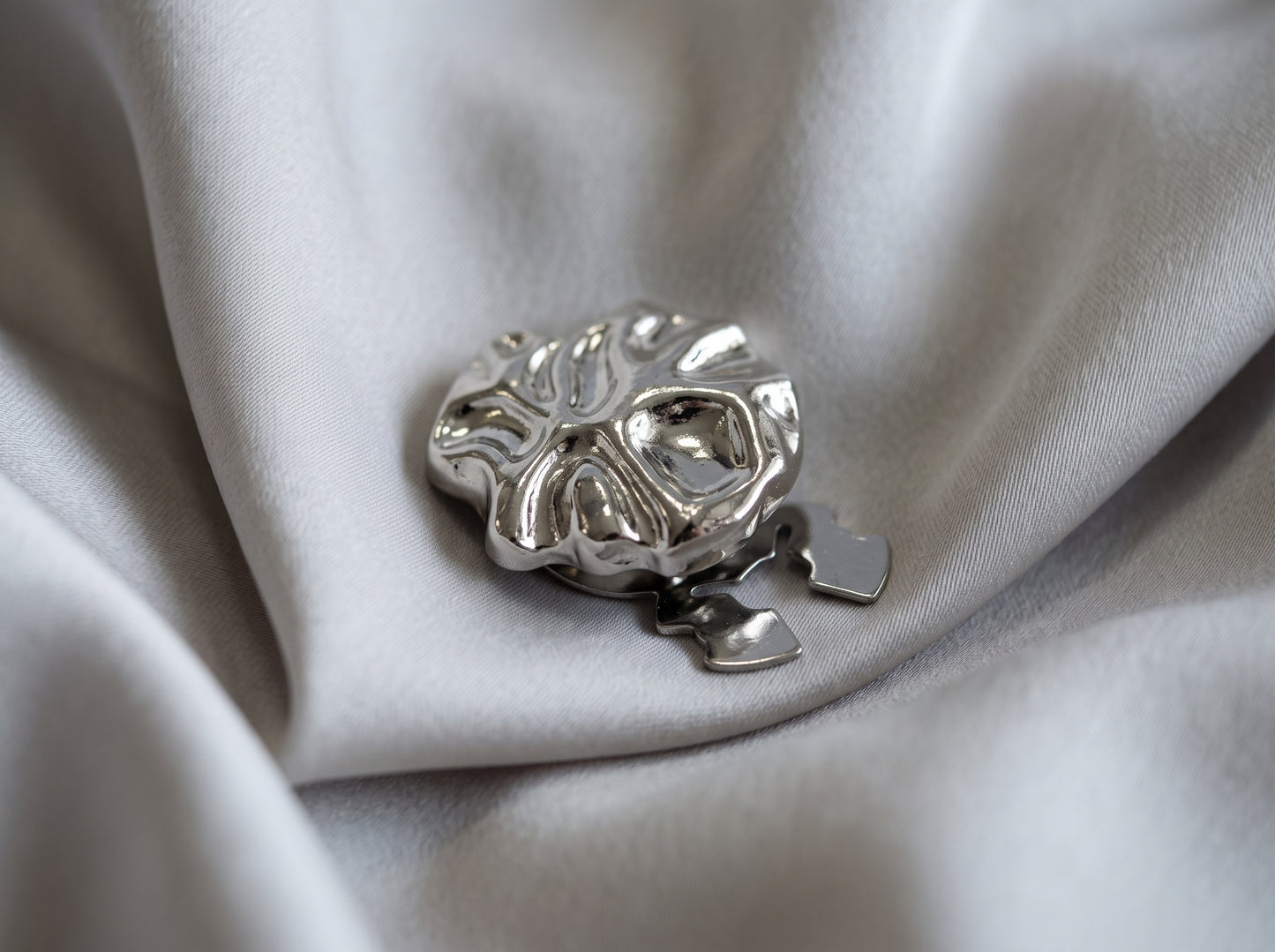 silver flat button