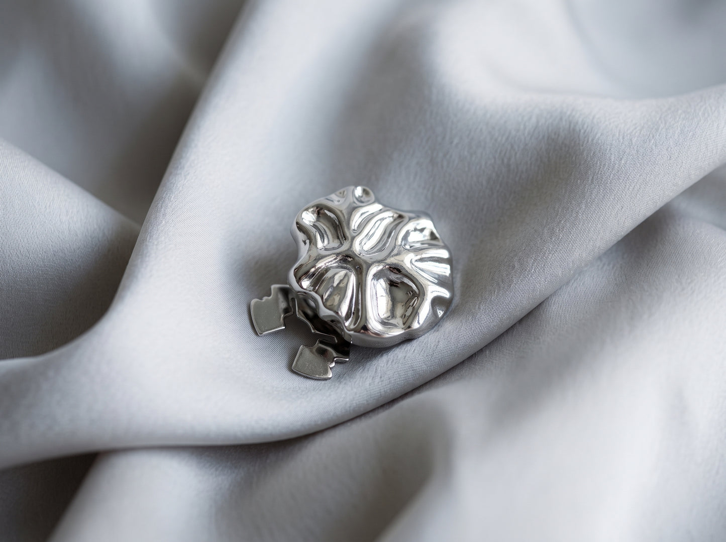 silver flat button